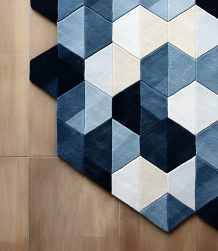 Handmade geometric hexagon rug in blue, navy, and cream, designed for modern and minimalist interiors, by Rugs Of Hindustan
