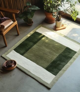 Green and white geometric area rug with minimalist design in a cozy modern living room.