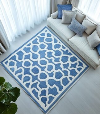 Blue abstract pattern area rug with a modern geometric design for stylish home interiors.