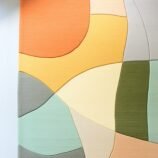 Modern abstract area rug with warm earthy tones and organic patterns, ideal for contemporary interiors.