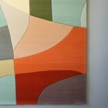 Modern abstract area rug with warm earthy tones and organic patterns, ideal for contemporary interiors.