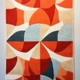Modern abstract geometric area rug in bold red and neutral tones, ideal for stylish and contemporary interiors.