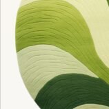 Modern green wave pattern area rug featuring vibrant shades of green, perfect for nature-inspired interiors.