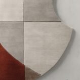 Modern geometric abstract rug with neutral beige, gray, and terracotta tones for contemporary interiors.