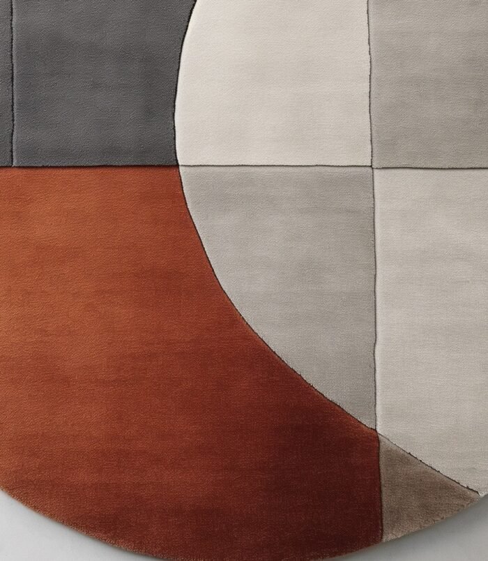 Modern geometric abstract rug with neutral beige, gray, and terracotta tones for contemporary interiors.