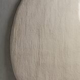 Ivory crescent moon rug featuring a lunar-inspired design in soft ivory tones for elegant modern interiors.