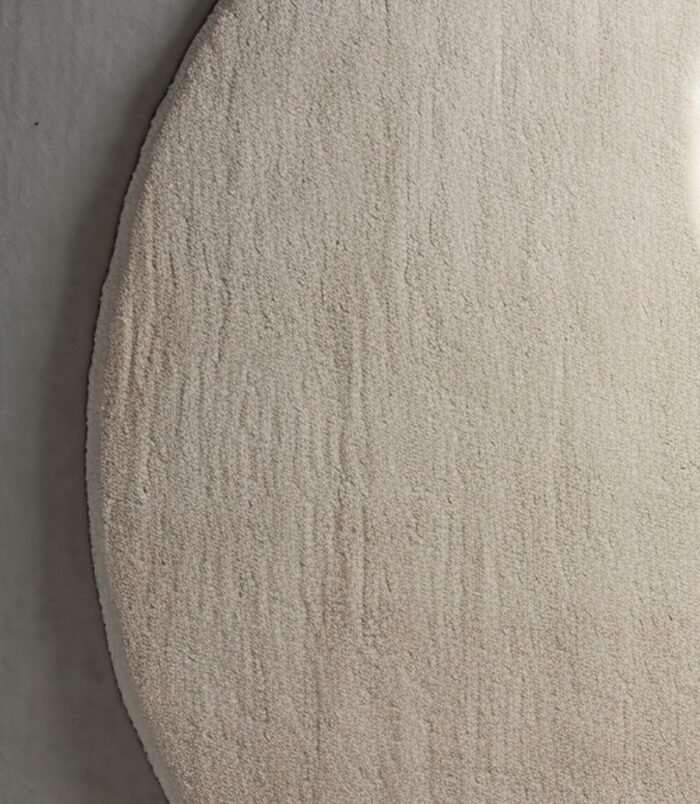 Ivory crescent moon rug featuring a lunar-inspired design in soft ivory tones for elegant modern interiors.