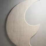 Ivory crescent moon rug featuring a lunar-inspired design in soft ivory tones for elegant modern interiors.