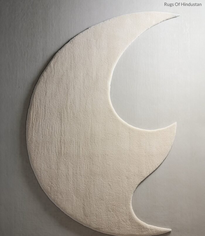 Ivory crescent moon rug featuring a lunar-inspired design in soft ivory tones for elegant modern interiors.