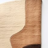 Earthy abstract rug featuring a blend of warm neutral tones in an organic pattern for contemporary interiors.