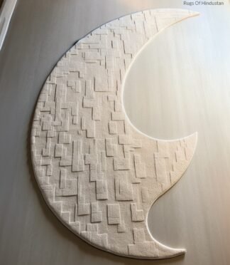 Crescent moon rug with geometric textures in neutral beige, designed for contemporary and minimalist interiors.