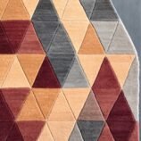 Triangular geometric rug in beige, maroon, and gray tones with a modern handcrafted design.