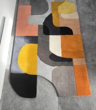 Abstract geometric runner rug in yellow, gray, and orange tones, ideal for kitchens and hallways.