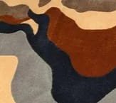 Unique abstract rug with brown, gray, and beige tones, perfect for modern interiors or therapy spaces.
