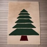 Beige hand-tufted wool rug with minimalist Christmas tree design in forest green