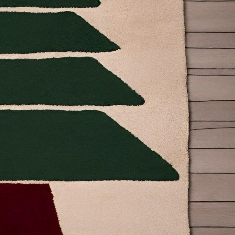 Beige hand-tufted wool rug with minimalist Christmas tree design in forest green