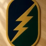 Hand-tufted wool rug in lightning bolt design with navy, green, and gold palette – by Rugs Of Hindustan