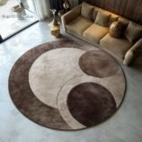 circular rug with geometric earth tones in mocha, taupe and beige by Rugs Of Hindustan