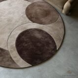 circular rug with geometric earth tones in mocha, taupe and beige by Rugs Of Hindustan