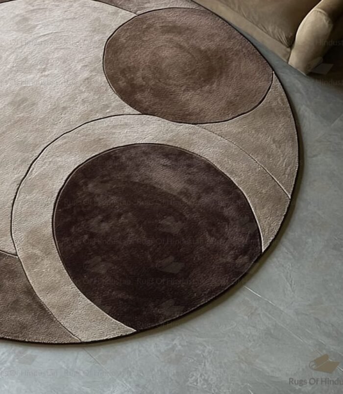 circular rug with geometric earth tones in mocha, taupe and beige by Rugs Of Hindustan