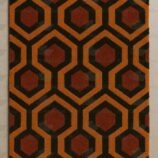 Handmade retro hexagon pattern wool rug with burnt orange and black geometric design
