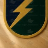 Hand-tufted wool rug in lightning bolt design with navy, green, and gold palette – by Rugs Of Hindustan