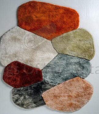 Irregular high-pile wool rug with organic color blocks in shag texture on modern white floor