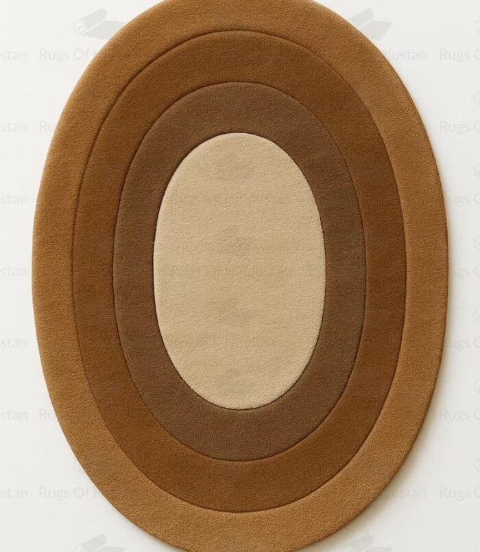 Concentric hand-tufted oval wool rug in gradient brown tones on white background