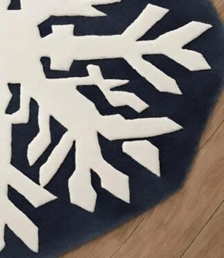 snowflake wool rug in white and blue octagonal design on wooden floor