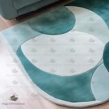 teal abstract wool rug with wave design in modern living room