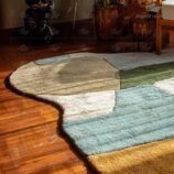 artistic multicolor wool rug with curved organic shape in modern interior