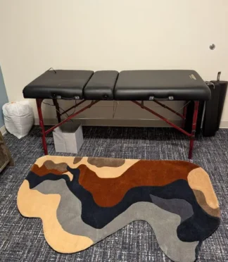 Unique abstract rug with brown, gray, and beige tones, perfect for modern interiors or therapy spaces.