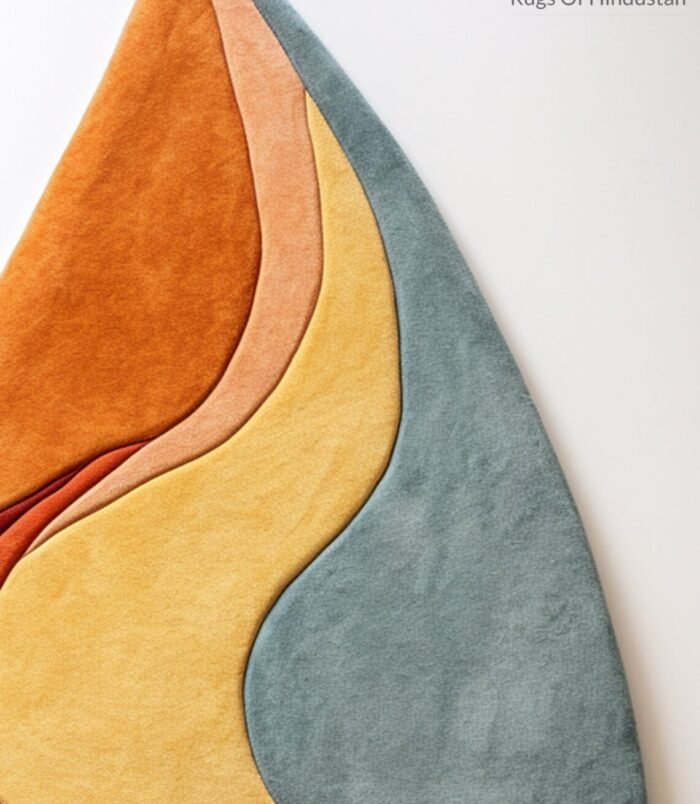 Handmade flame-inspired wool rug in blue, gold, orange & brown – modern tufted abstract carpet.