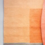 Handmade geometric abstract wool rug in warm & neutral tones, perfect for modern home decor.