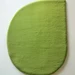 Modern green leaf-shaped rug with minimalist organic design, perfect for eco-friendly interiors.