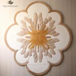 Luxury floral-shaped beige and gold area rug, a handcrafted statement piece for elegant interiors.
