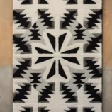 Handcrafted Southwestern black and white geometric wool rug with tribal pattern for elegant home décor.