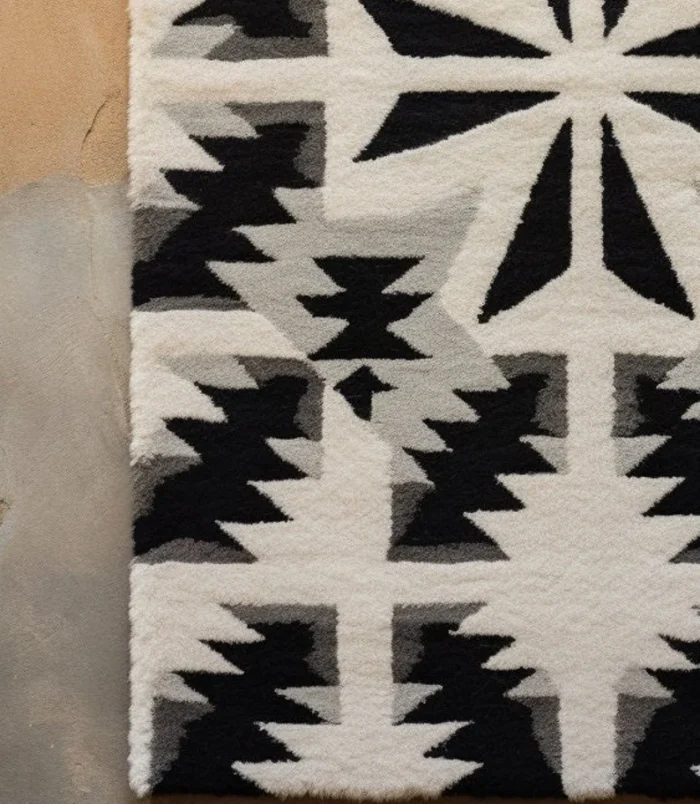Handcrafted Southwestern black and white geometric wool rug with tribal pattern for elegant home décor.