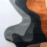 Round red rug with reindeer design for Christmas décor and holiday charm.