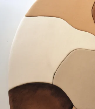 Neutral abstract half-moon rug in earthy tones, perfect for modern and minimalist interiors.