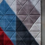 Handwoven Bohemian geometric wool rug with black and white pattern for stylish and cozy interiors.