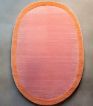 Peach pink oval rug with soft orange border on minimalist background – modern wool carpet