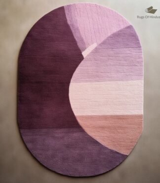 Modern oval abstract rug in shades of purple and pink with a unique artistic design